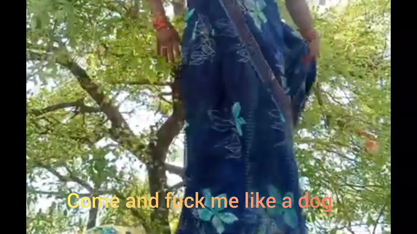 Asking pleasure outdoor in the farm sitting wearing saree