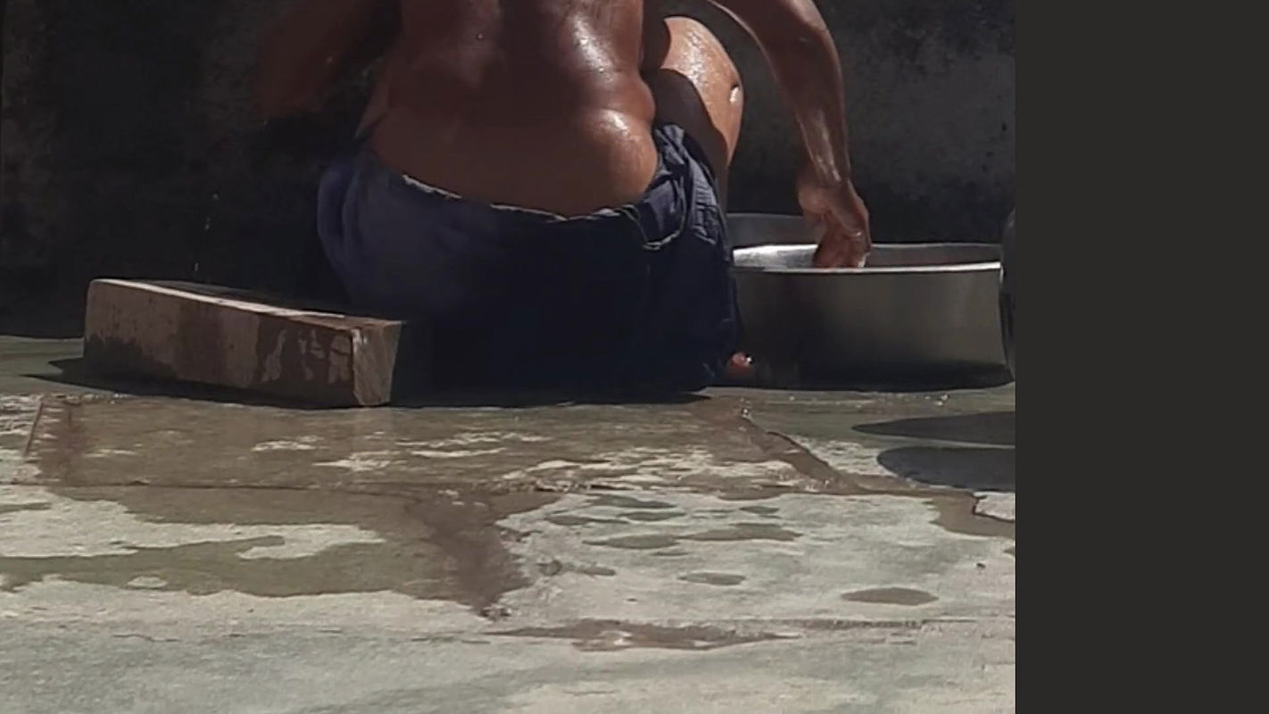 Desi sister-in-law is taking a bath in an open bathroom near the road on the edge of the forest on the farm