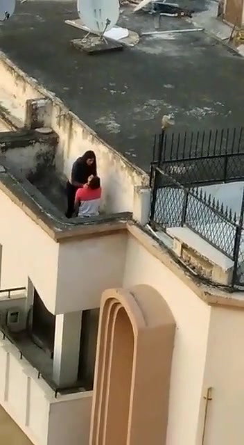 Young lover having on roof,captured