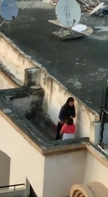 Young lover having on roof,captured