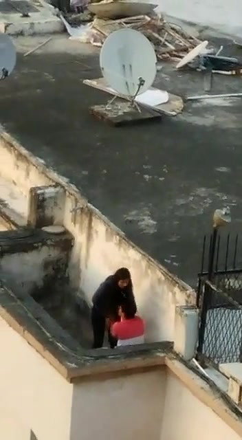 Young lover having on roof,captured