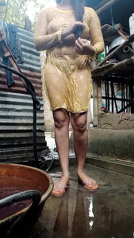 Young girl is bathing in bathroom.
