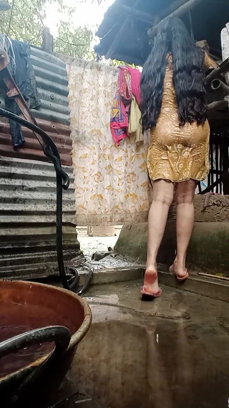 Young girl is bathing in bathroom.