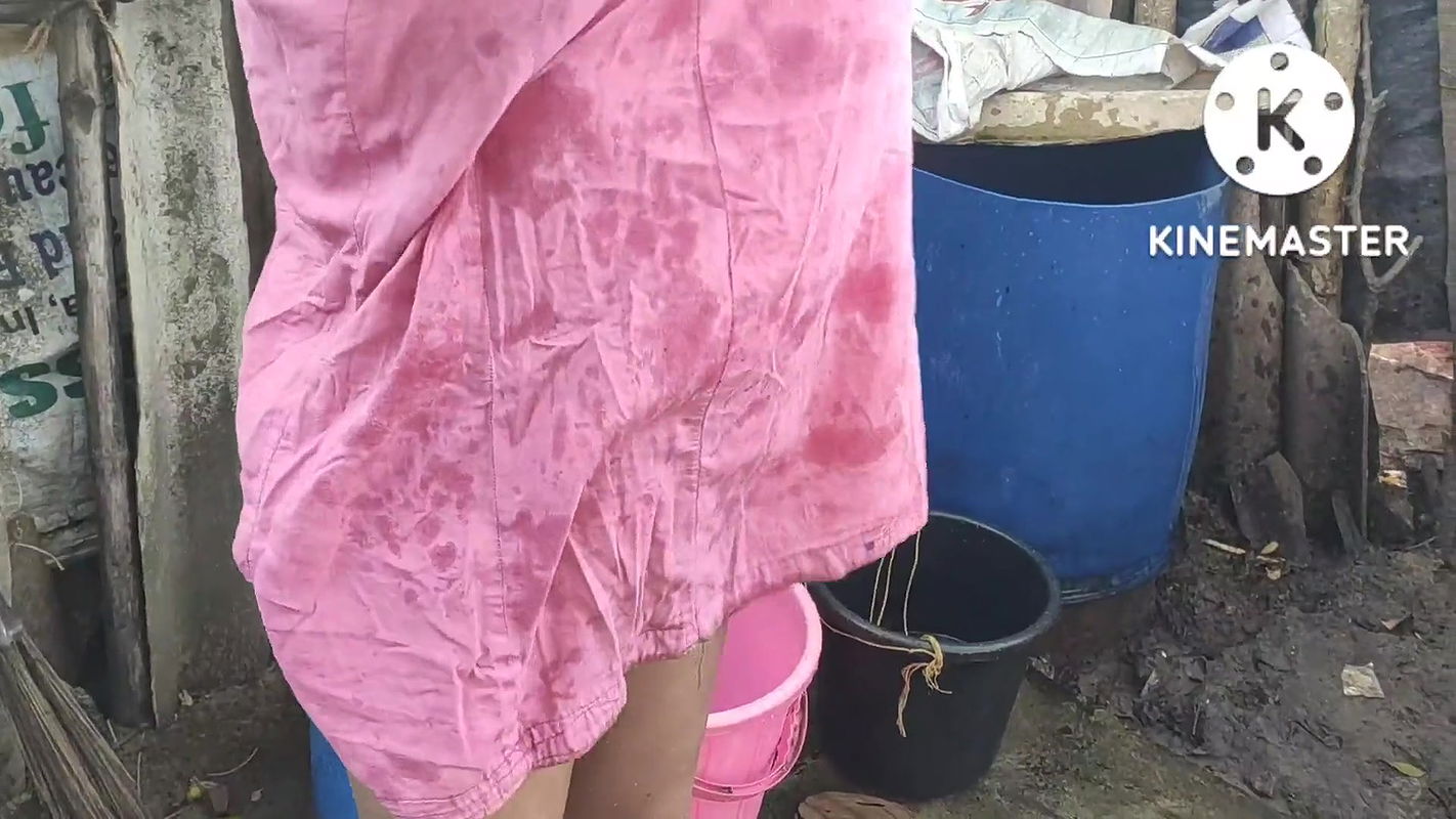 Indian house wife bathing in bra