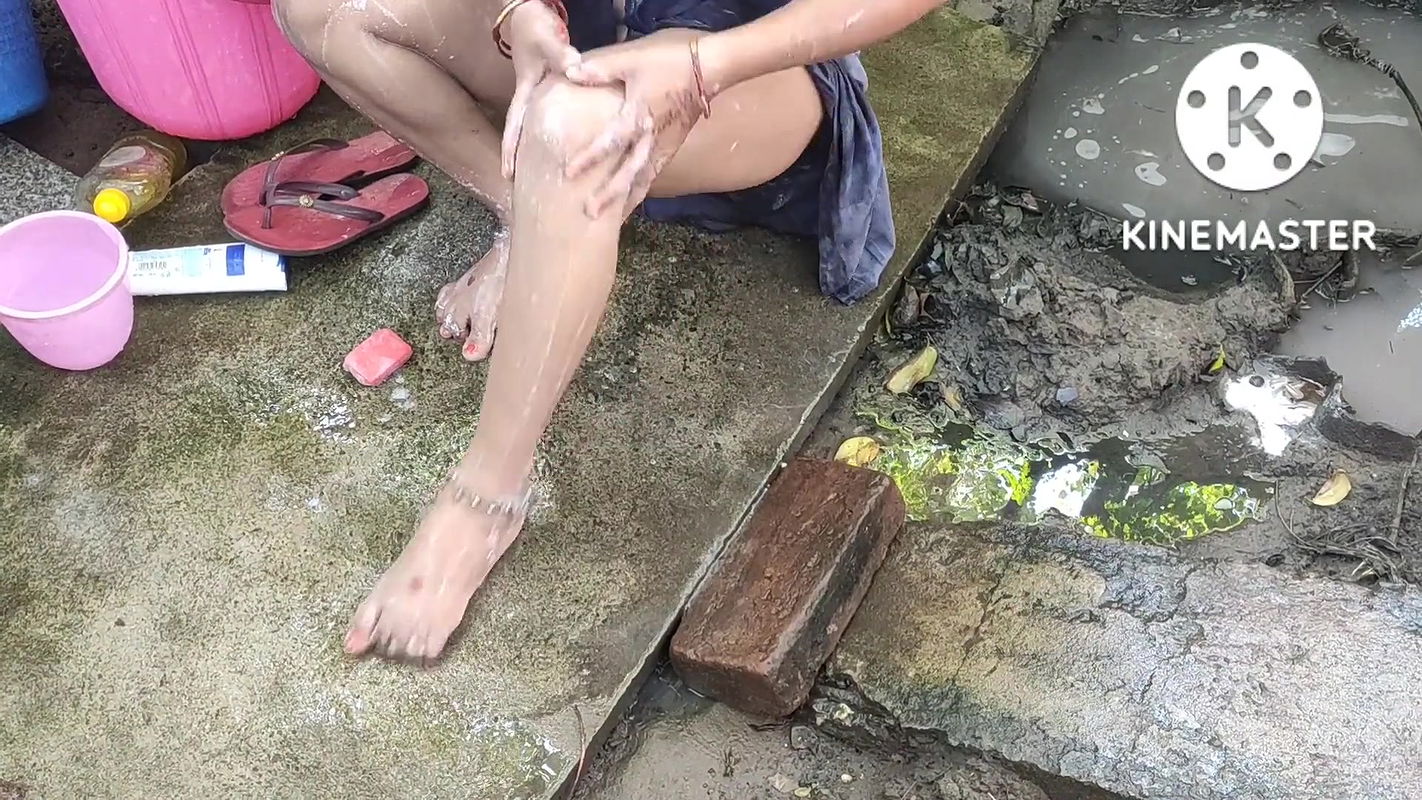 Indian house wife bathing in bra