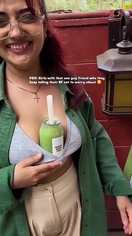 Sexy girl boobs enjoyed by boyfriend drinking juice