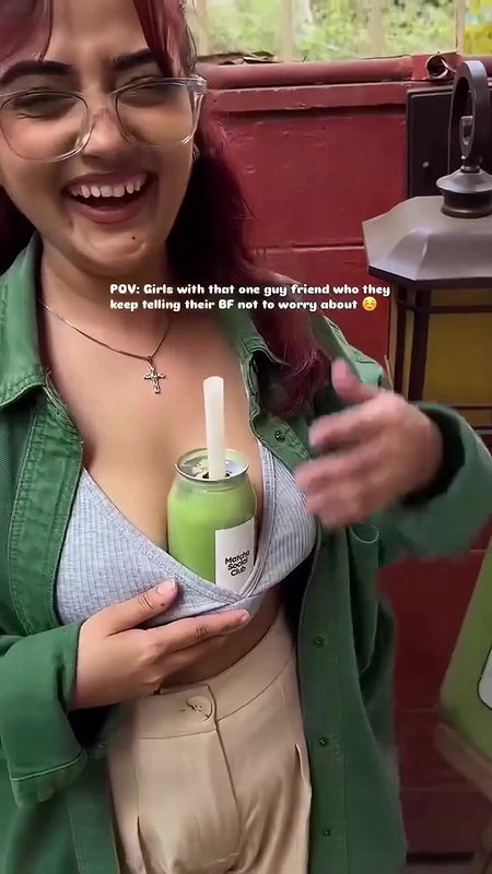 Sexy girl boobs enjoyed by boyfriend drinking juice