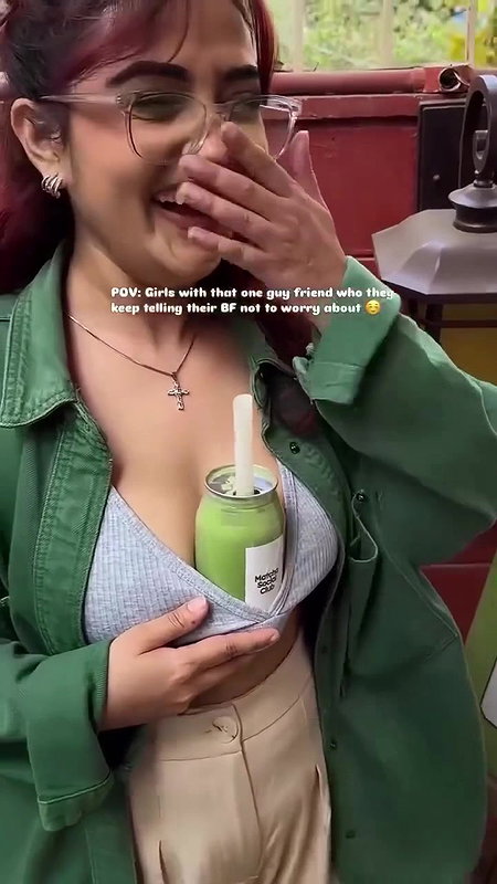 Sexy girl boobs enjoyed by boyfriend drinking juice