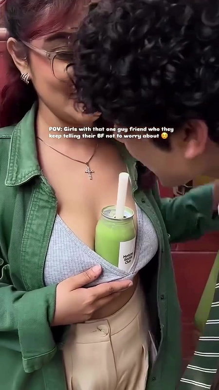 Sexy girl boobs enjoyed by boyfriend drinking juice