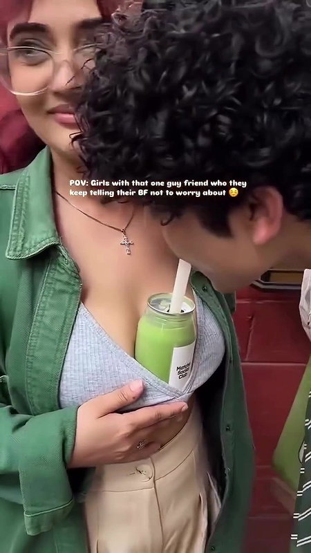 Sexy girl boobs enjoyed by boyfriend drinking juice