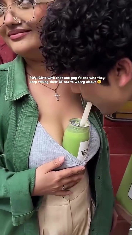 Sexy girl boobs enjoyed by boyfriend drinking juice