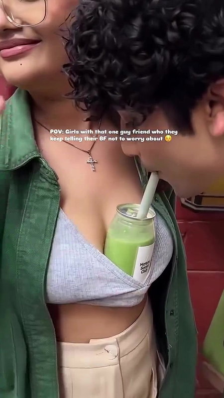 Sexy girl boobs enjoyed by boyfriend drinking juice
