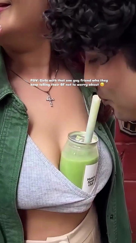 Sexy girl boobs enjoyed by boyfriend drinking juice