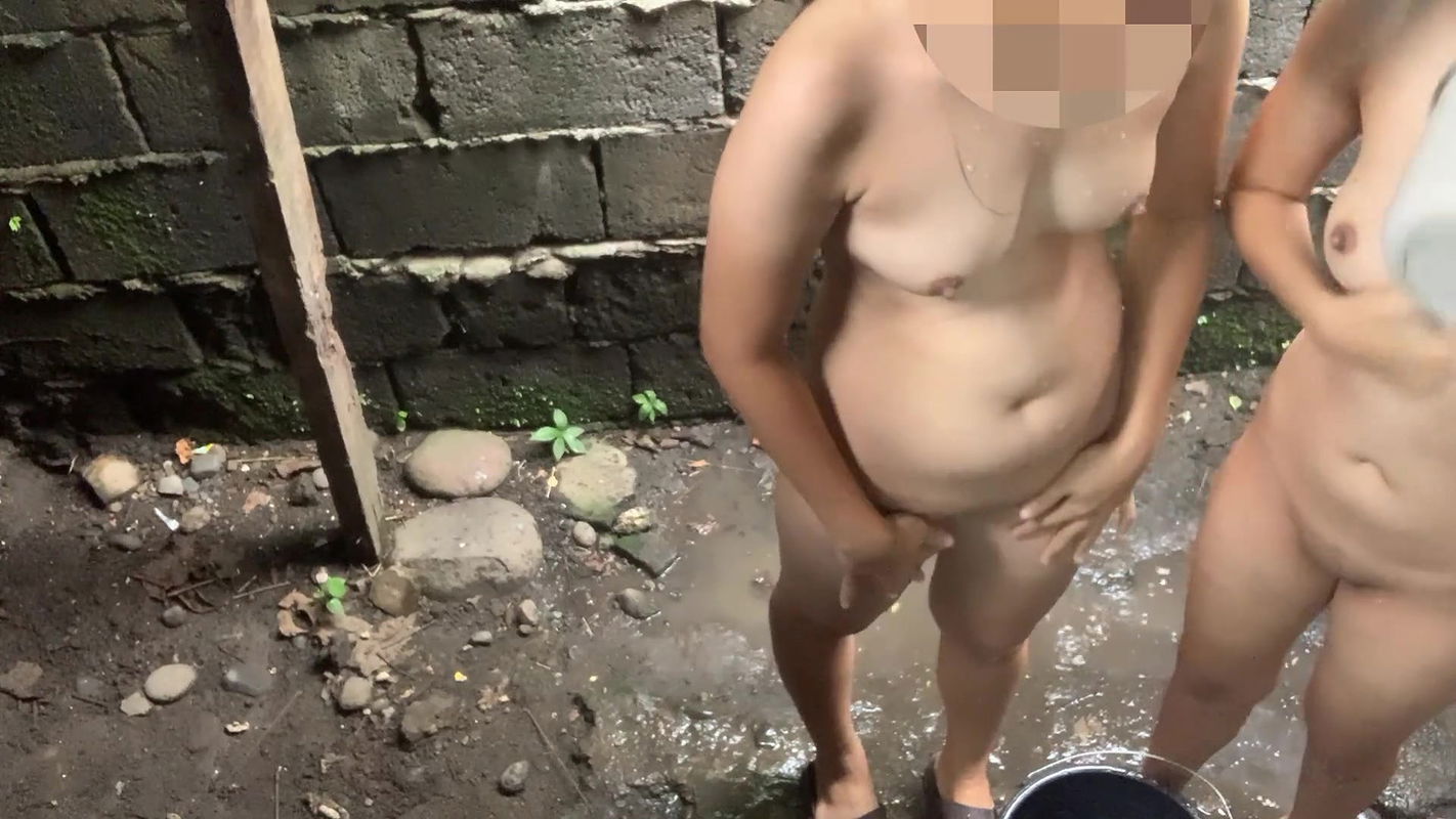 Taking a bath outside our house