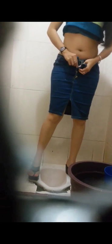 Young woman hairy pussy visible while pissing in toilet