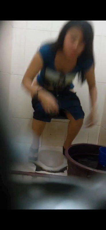 Young woman hairy pussy visible while pissing in toilet