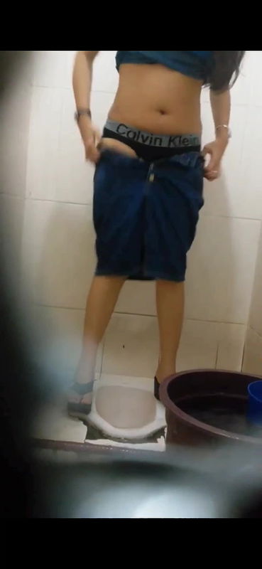 Young woman hairy pussy visible while pissing in toilet