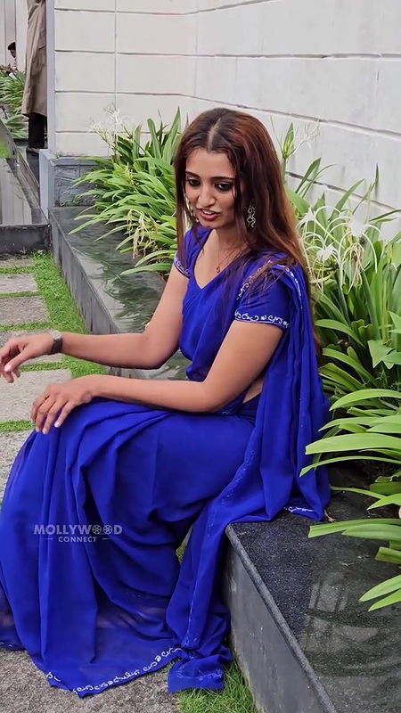 angel thomas sexy wide belly and deep navel hole in transaparent violet saree 2