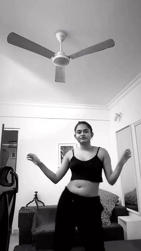 malayali actress sexy pierced navel and boobs in black costume 2