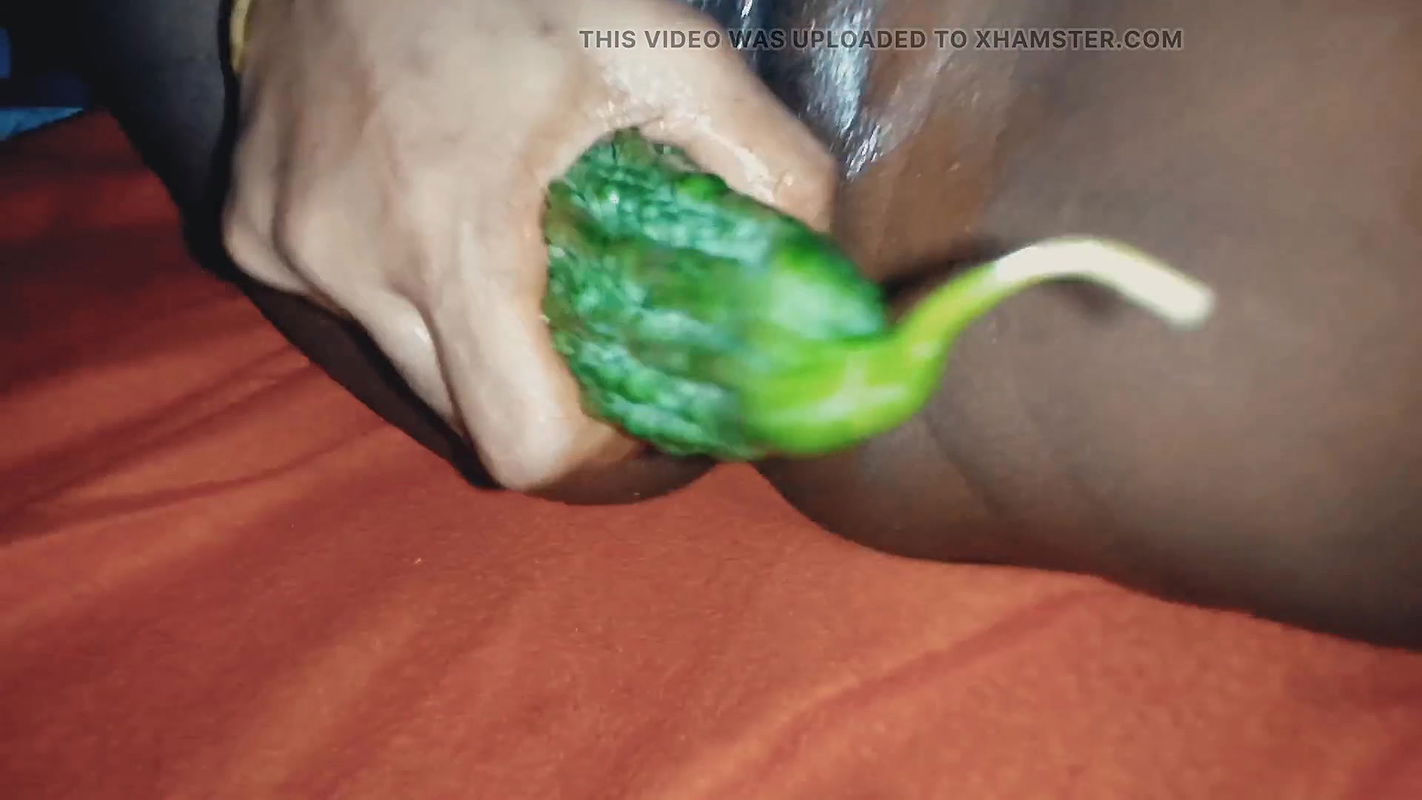 Bangladeshi Bhabhi stuffed a big bitter gourd inside her pussy