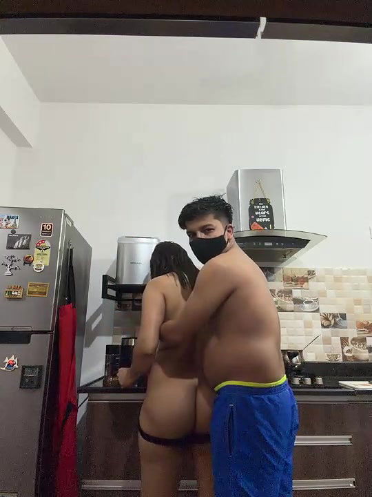 Young couple love rose fun in kitchen