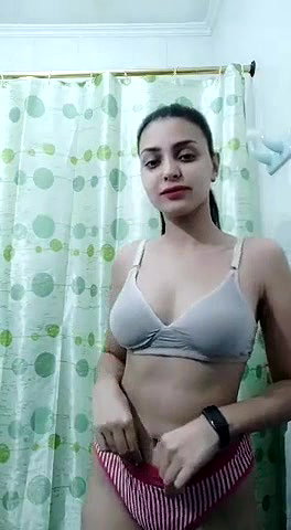 Cute hot girl tease with her round boobs in bathroom