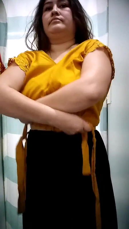 Plump lady big Boobs and cleavage in black bra in trial room