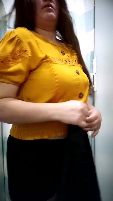 Plump lady big Boobs and cleavage in black bra in trial room