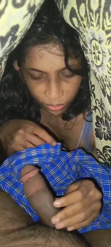 Cute girl giving blowjob to het boyfriend under bed cover