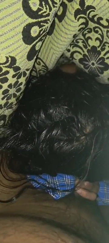 Cute girl giving blowjob to het boyfriend under bed cover