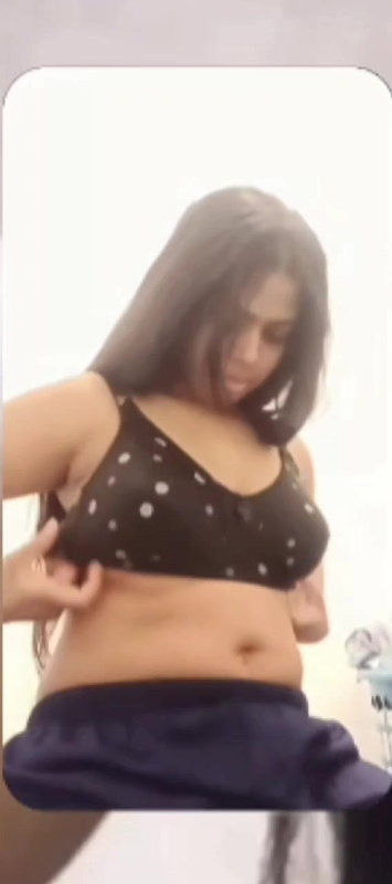 Chubby shy Indian girl showing round boobs to lover