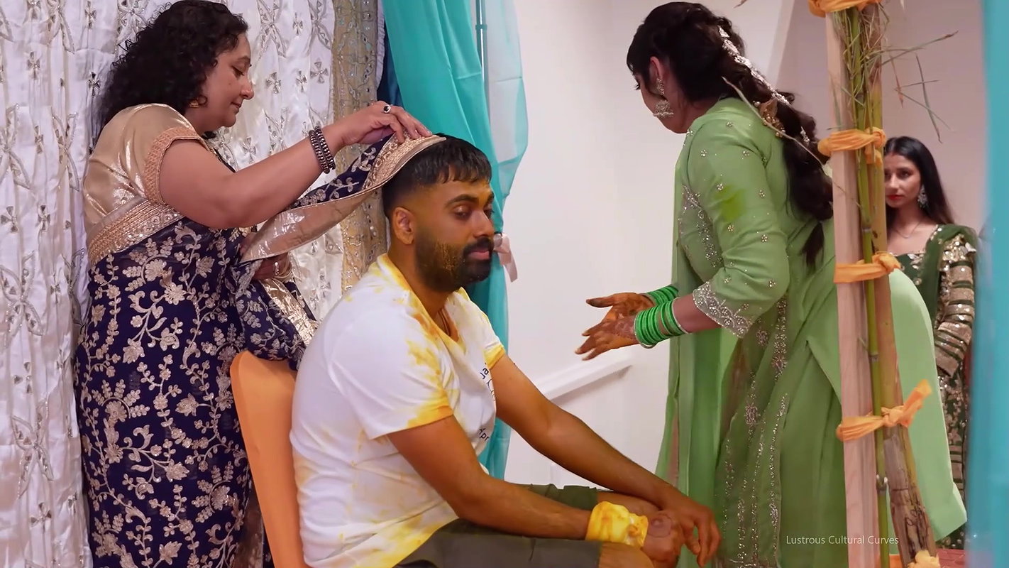 Punjabi Girl sexy cleavage and boobs in green and orange costume