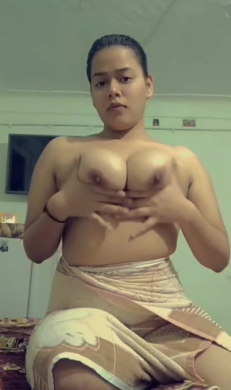 Sexy cute babe oiling her nude boobs with face