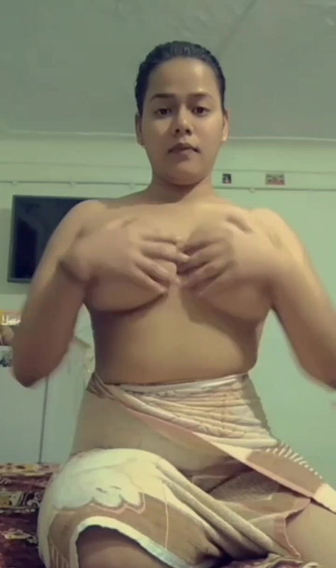 Sexy cute babe oiling her nude boobs with face