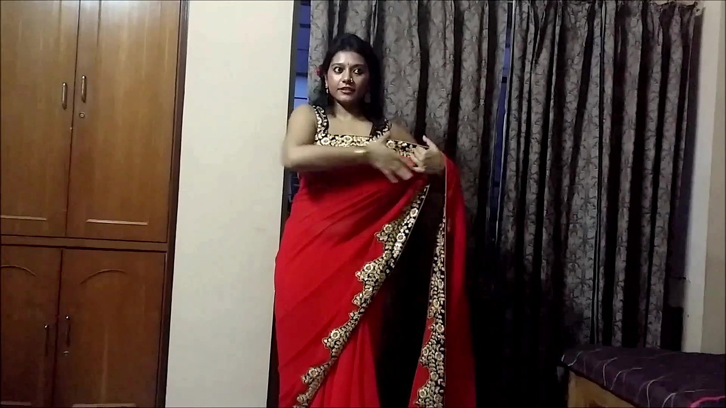 Bengali Lady sexy saree drape in red saree showing pierced fleshy navel 22