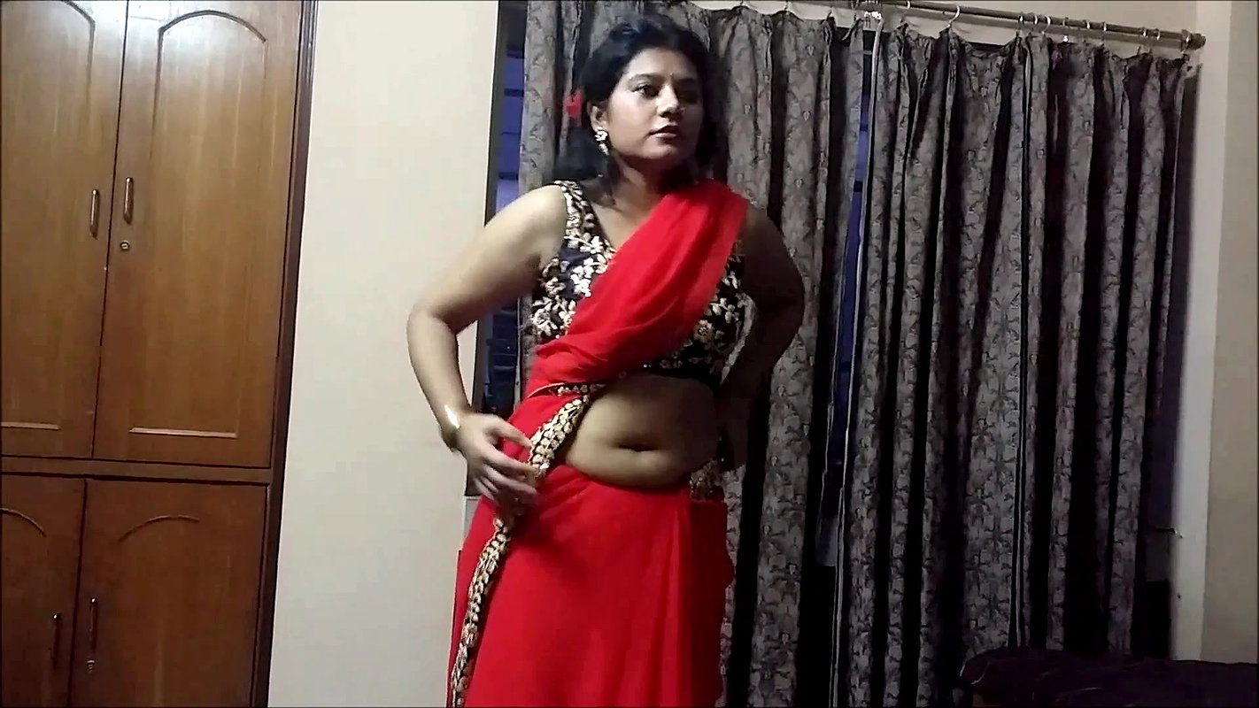 Bengali Lady sexy saree drape in red saree showing pierced fleshy navel 22