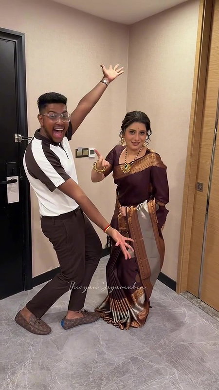 Vijay TV Anchor Priyanka saree wearing by unknown guy 22