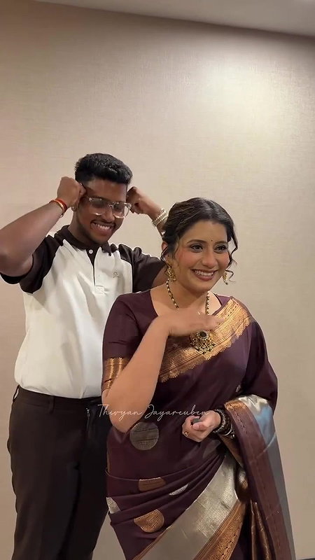 Vijay TV Anchor Priyanka saree wearing by unknown guy 22