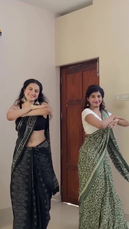cute malayali girl sexy pierced navel dance in black saree 22