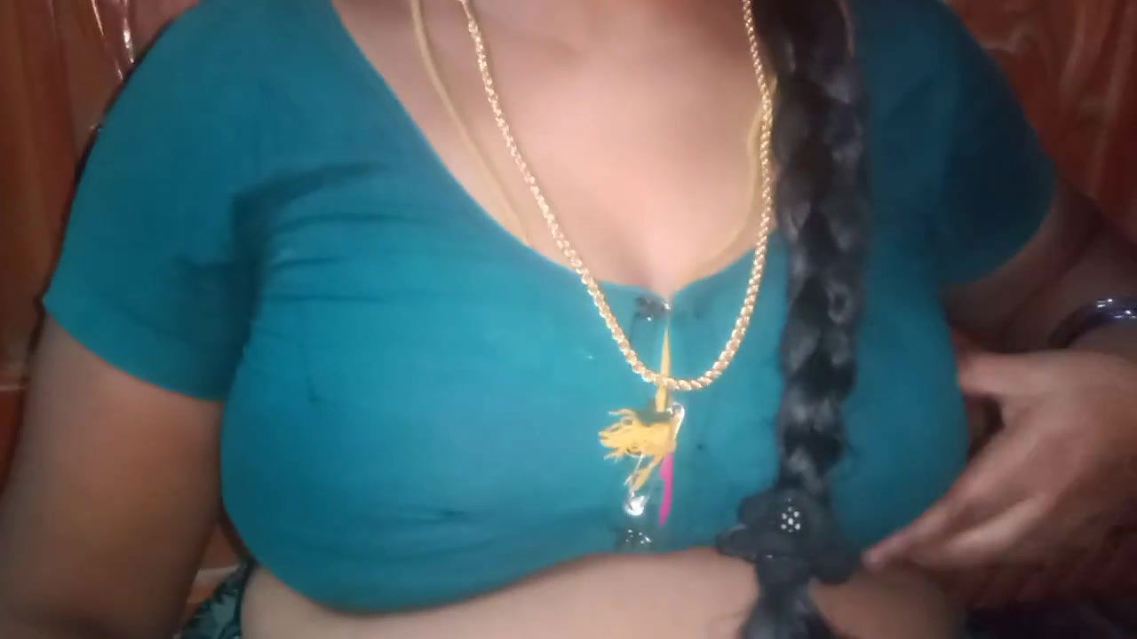 Tamil aunty squeezing her breasts when she is alone and unable to control her emotions.
