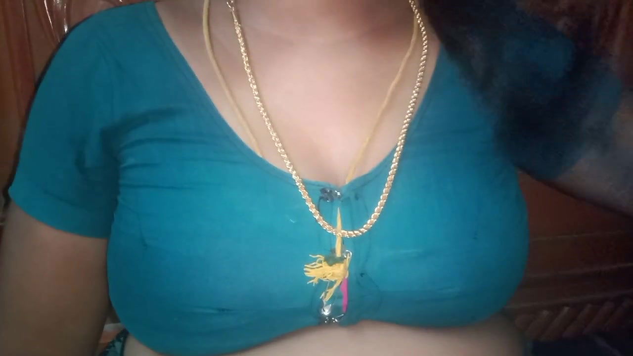 Tamil aunty squeezing her breasts when she is alone and unable to control her emotions.