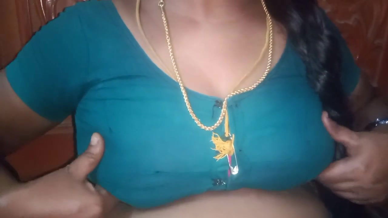 Tamil aunty squeezing her breasts when she is alone and unable to control her emotions.