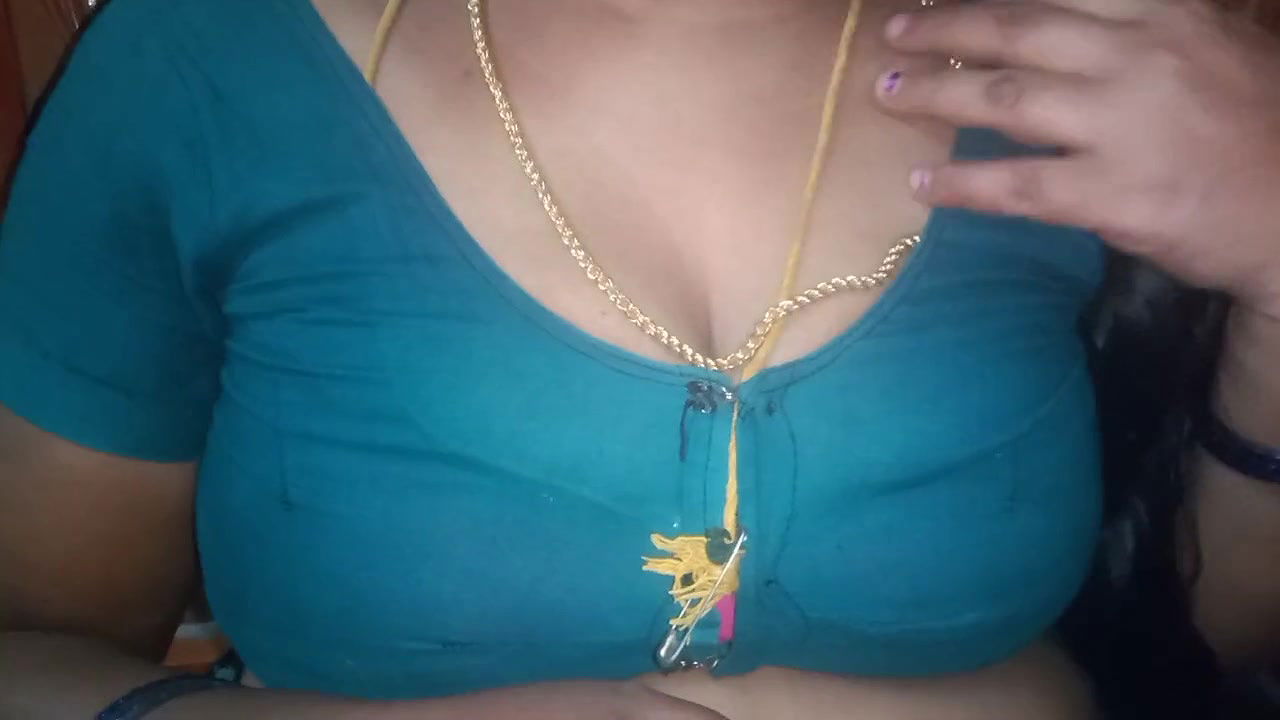 Tamil aunty squeezing her breasts when she is alone and unable to control her emotions.