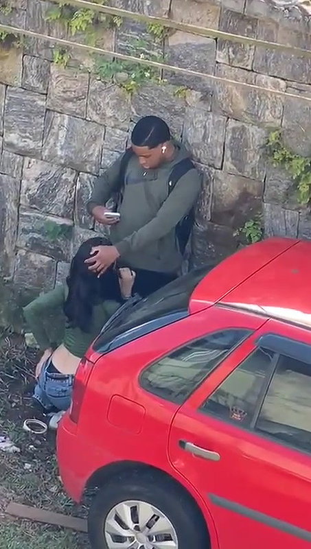 Young girl sucking a black guy’s dick in public 22