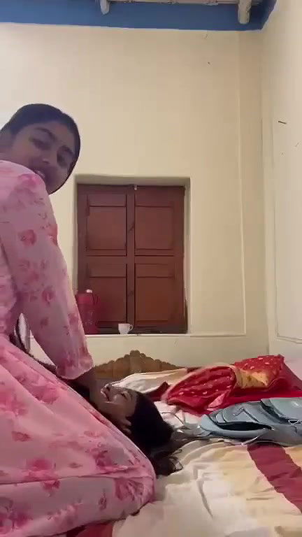 Young girl Undressing By Her Friend