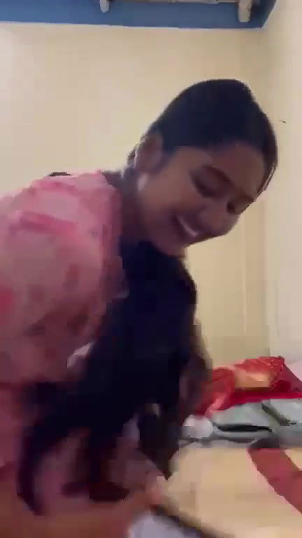 Young girl Undressing By Her Friend