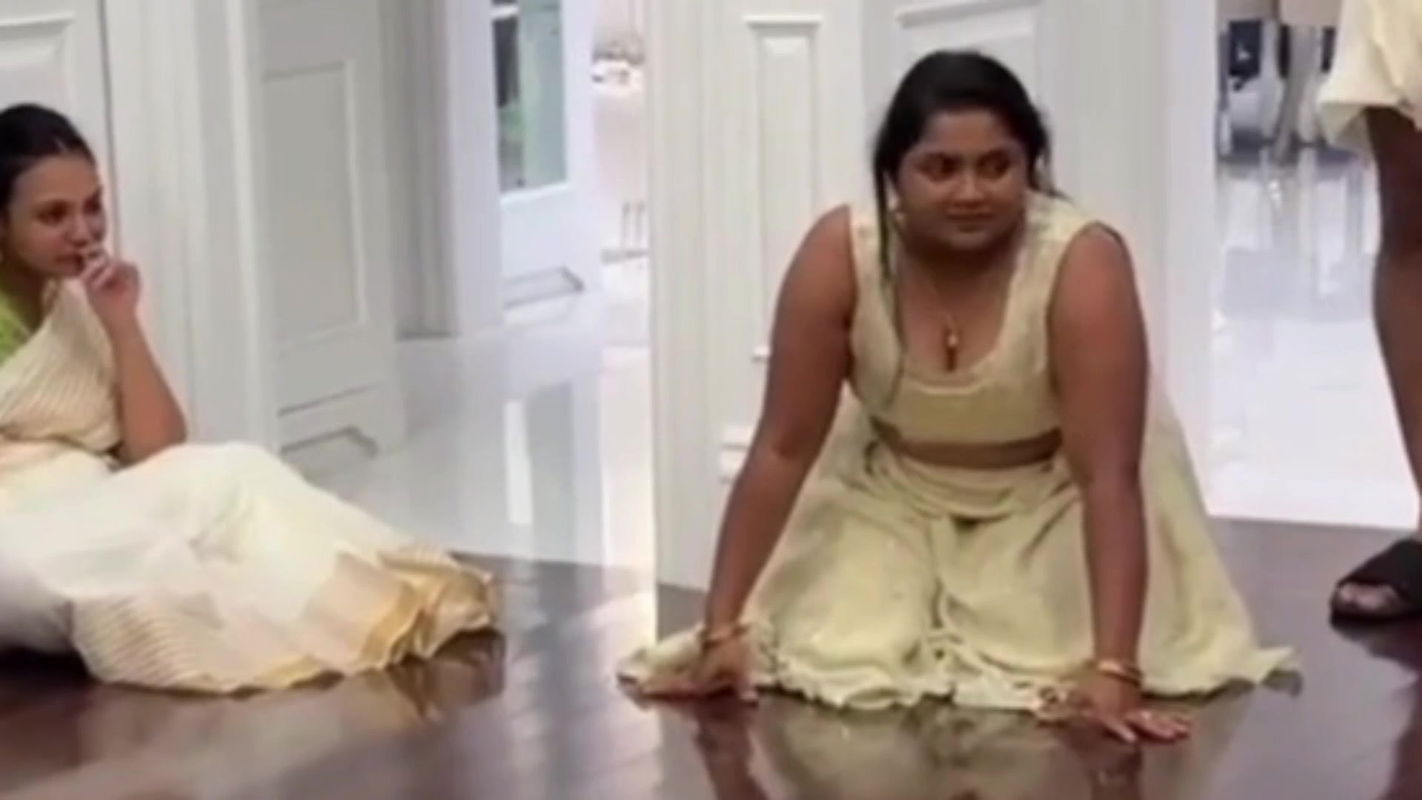 Malayali busty lady wide cleavage show in cream costume 22