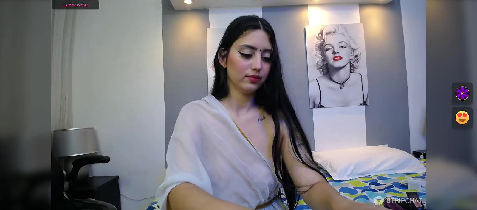 Hot beauty in see through white saree showing her boobs