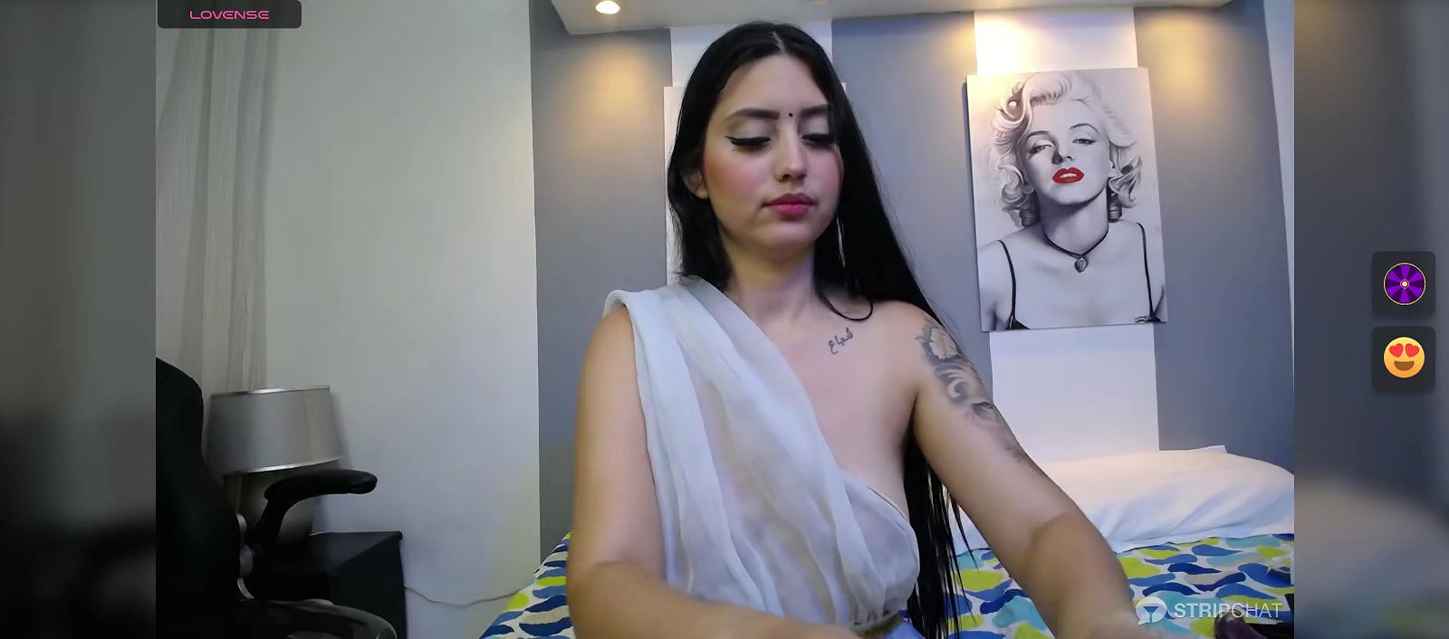 Hot beauty in see through white saree showing her boobs