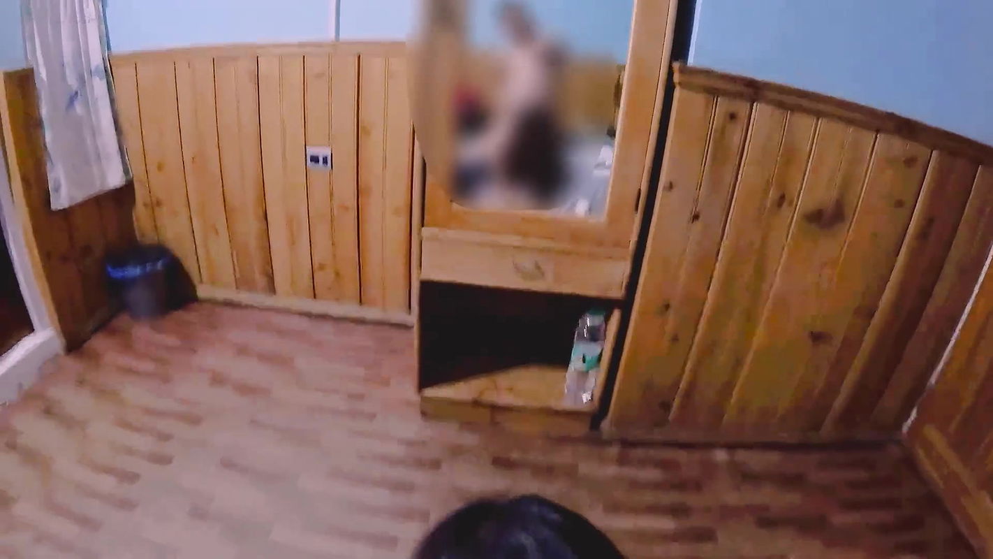 Passionate Couple Making Love in a Hotel Room